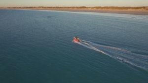 Boat Hire boat cruising off Cable Beach, Broome, West Australia.