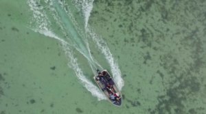 Aerial view of dinghy on Shark Bay shallows, West Australia