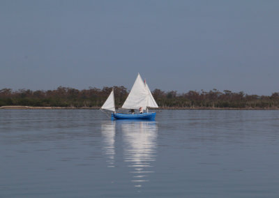Blue yacht sailing on Lake King, Gippsland Lakes